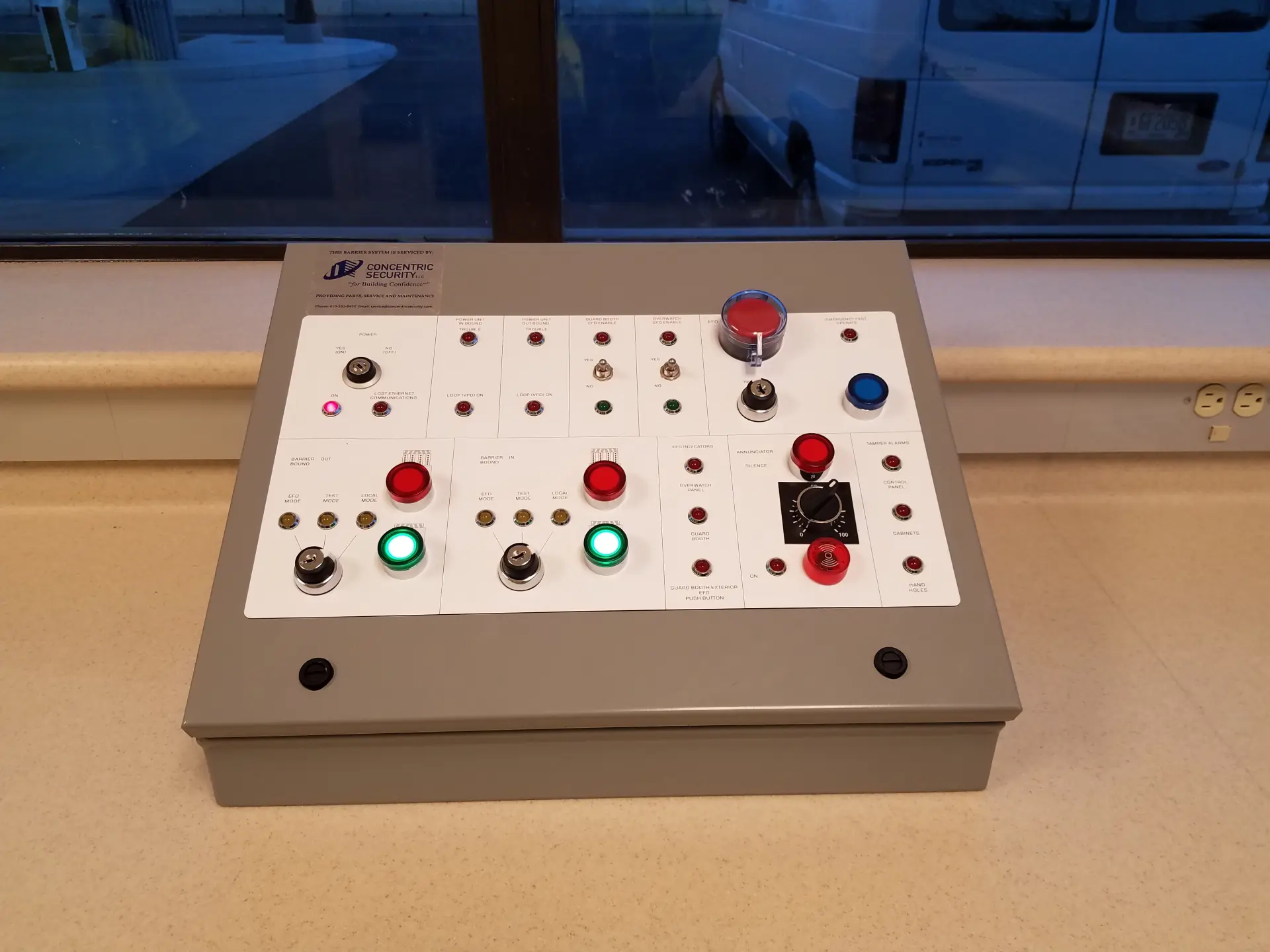 Access control panel with colored buttons and indicator lights for system operation.