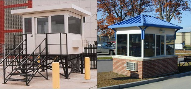 Guard booths for facility entrance, one with brick and another on black platform.